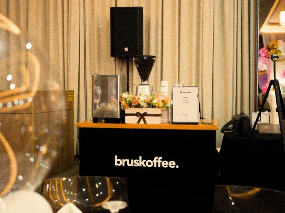 The branded Bruskoffee coffee cart set up at a private event
